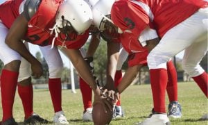 football team in huddle