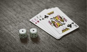 king playing cards and dice