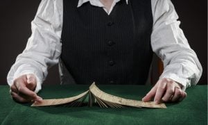 dealer shuffling cards