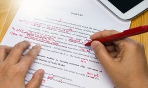 Paper being marked up for editing