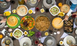 overhead view of crowded kitchen table