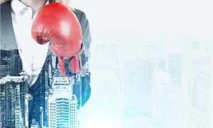 woman with boxing glove and city skyline