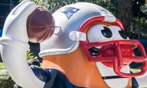 cartoon statue with Patriots helmet
