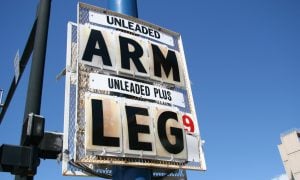 gas price sign reading "arm" and "leg"