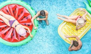 overhead view of people on floats in pool