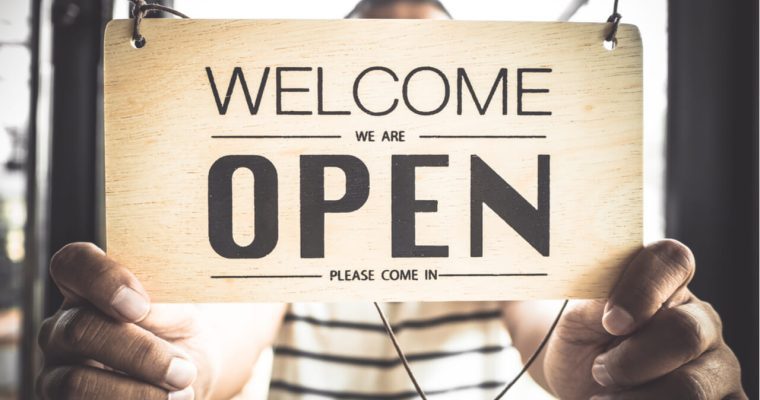 hands on OPEN sign