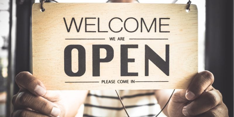 hands on OPEN sign