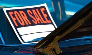 For Sale sign on car