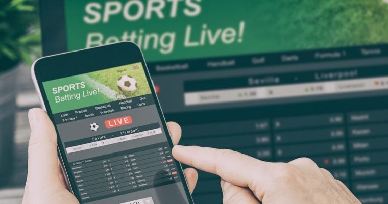 An image of someone playing sorts betting live on their phone