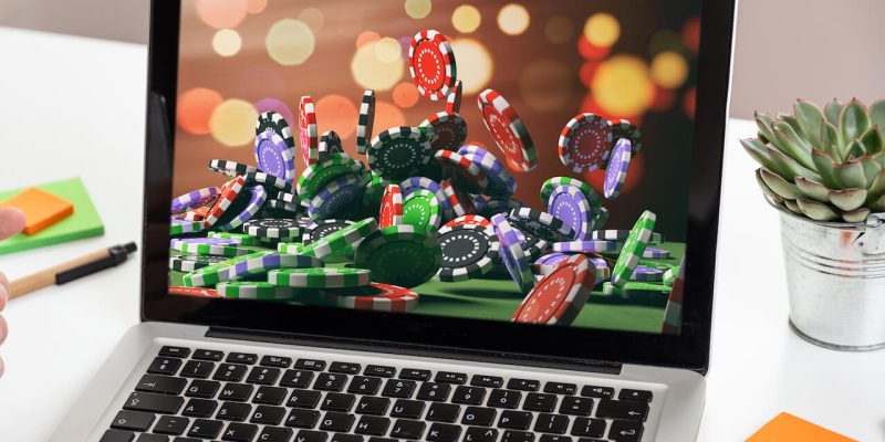 Casino chips on a laptop screen
