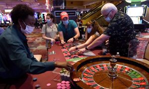 Casino players wearing mask at an MGM Resort