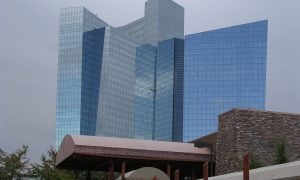 A tall glass blue building