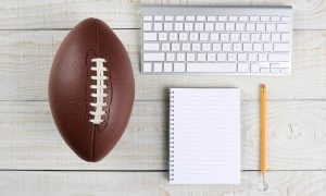Desk with a Keyboard and a Football