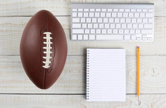 Desk with a Keyboard and a Football