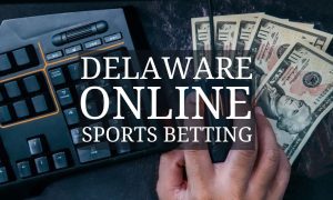 Computer Keyboard And Man's Hand Grabbing Cash with Delaware online sports betting