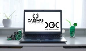 Desktop Laptop Displays Caesars Casino and DGC Logos. Caesars online casino app will feature games by DGC