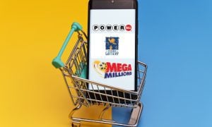 mobile phone holds online shopping cart with texas lottery games
