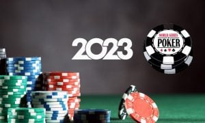 poker chips resting on felt table as the 2023 world series of poker begins