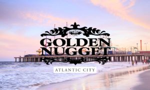 Dusk at Atlantic City Pier By The Beach With Golden Nugget Logo. The Golden Nugget's Atlantic City casino is the subject of a lawsuit.