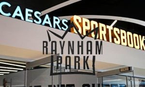 Exterior of Caesars Sportsbook with Raynham Park Logo. retail sport betting approved at OTB site