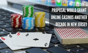 computer with gambling chips and playing cards represents online casinos in new jersey