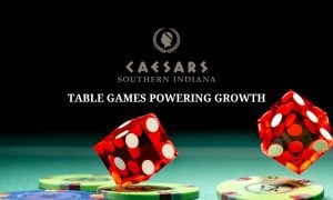 red dice landing on gambling chips on gaming table at caesars southern indiana casino
