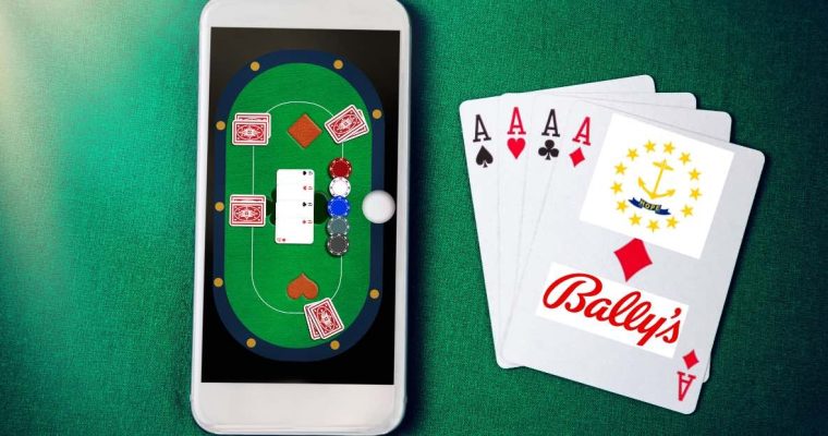 phone displaying online casino app on green felt next to playing cards bearing bally's logo and rhode island seal