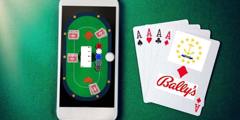 phone displaying online casino app on green felt next to playing cards bearing bally's logo and rhode island seal