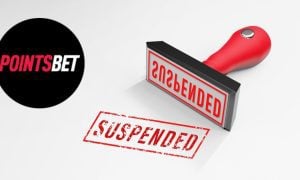 stamp of word suspended in red ink next to pointsbet logo