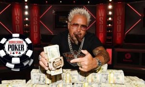 Guy Fieri Poses with 2023 World Series Of Poker Main Event Bracelet and stack of cash at Horseshoe Las Vegas casino