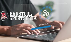 Man on Laptop makes Software Upgrades and Barstool Sportsbook logo