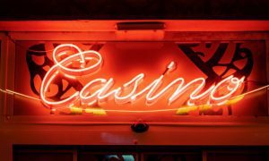 Neon red casino sign at night