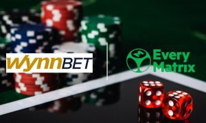 Poker Chips and Dice On Tablet representing online games with WynnBet and EveryMatrix logos