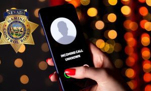 Unkown Caller On Mobile Phone Inside Casino implying a scam phone call and NGCB logo