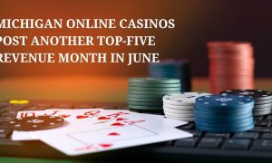 playing cards and gambling chips resting on keyboard representing michigan online casino revenue