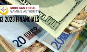 Stack of Different Currencies in Cash with Mohegan Tribal Gaming Authority and Q3 2023 financials