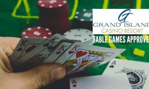 Texas Hold 'em Player Reveals Kings with table games approved and Grand Island Casino Resort logo