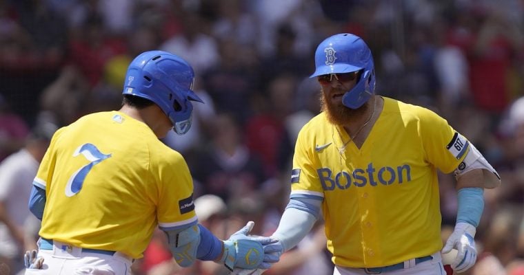 boston red sox teammates justin turner and matasha yoshida slap hands