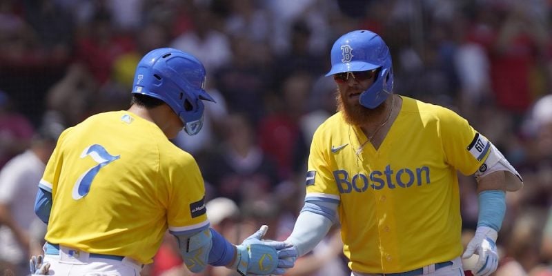 boston red sox teammates justin turner and matasha yoshida slap hands