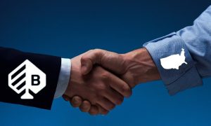 people shaking hands representing bragg gaming's expansion in the united states