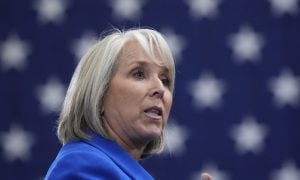 lujan grisham speaking amid starry background