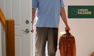 person entering house next to caesars racebook logo
