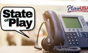 headset rests on desktop phone next to state of play logo and playusa logo