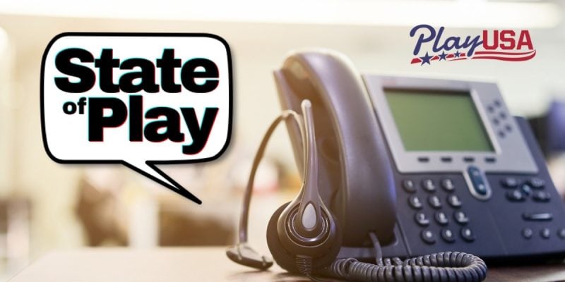 headset rests on desktop phone next to state of play logo and playusa logo