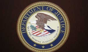 the seal of the united states department of justice on a wall