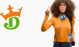 woman extends pointer finger to signify the number one next to the draftkings logo