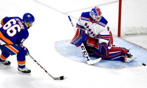 New York Rangers goalie Stops A Breakaway Shot attempt by New York Islanders