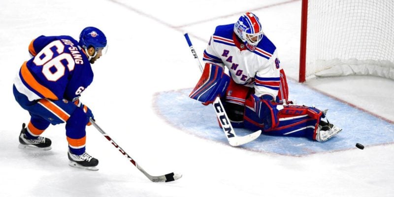 New York Rangers goalie Stops A Breakaway Shot attempt by New York Islanders