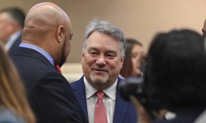 nathaniel ledbetter listens to a colleague