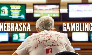 A Patron Watches Screens At Horsemen's Park Racing Track Omaha with Nebraska gambling